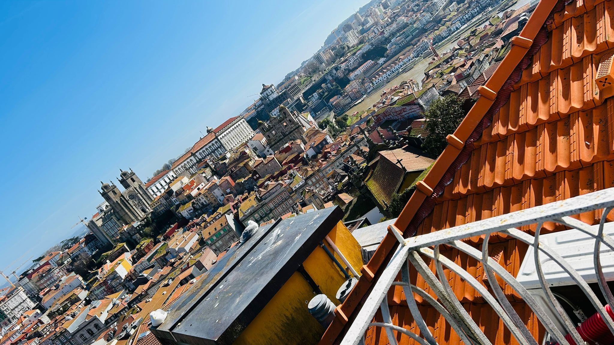Open balcony at golden hour, view over the Douro river and the Historic Centre